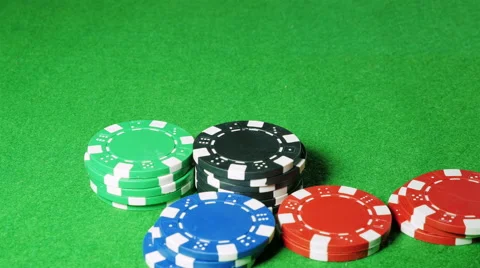 Man moves a stack of black poker chips Stock Footage 58743510