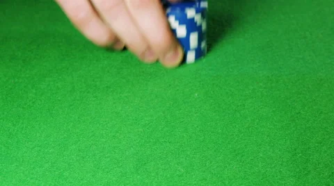 Man moves a stack of blue poker chips Video stock 58743520