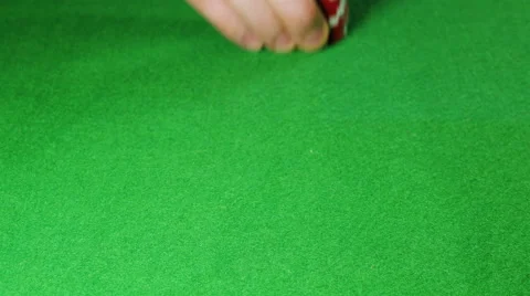 Man moves a stack of red poker chips Stock Footage 58742958