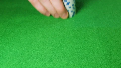 Man moves a stack of white poker chips Stock Footage 58743441