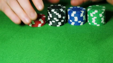 Man moves stacks of poker chips Stock Footage 58744030
