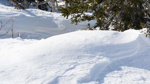 A man moves through the deep snow in winter in Sunny weather  Stock-Footage 106197381