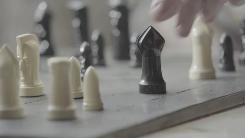 Man moving backwards on chess board Stock Footage 91146125