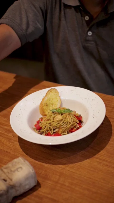 Man Moving His Hand Over A Fully Topped Spaghetti Bolognese Stock Footage 300070399