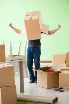 Man moving house with boxes Stock Photos