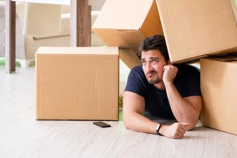 Man moving house with boxes Stock Photos
