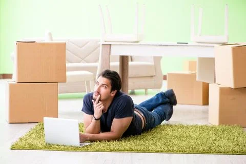 Man moving house with boxes Stock Photos