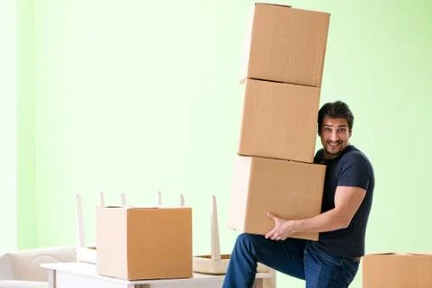 Man moving house with boxes Stock Photos