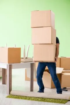 Man moving house with boxes Stock Photos