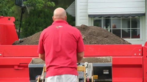 Man Moving large amount of Dirt 動画素材 6789748