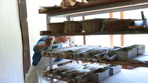 Man moving the shelf with bread Video stock 161888124