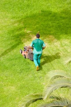 Man mowing grass Stock Photos
