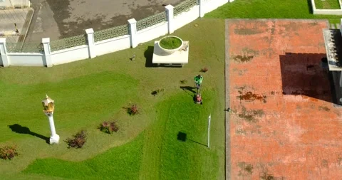 A man mowing the grass with a push mower Stock Footage 228169861