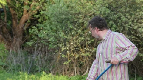 Man mowing the grass at sunset Stock Footage 62802176