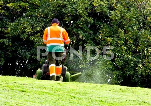 Man mowing Stock Photos