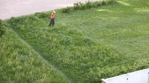 Man mows the grass on the field, timelapse Vídeos de archivo 6279561
