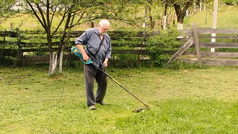 Man mows the grass MVI 9341 398 Stock Footage 168023083