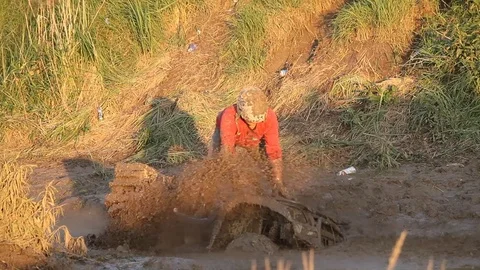 Man in the mud with a 4×4 vehicle Stock Footage 71492204