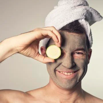 Man with a mud mask on this face Stock Photos
