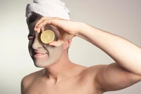 Man with a mud mask on this face Stock Photos