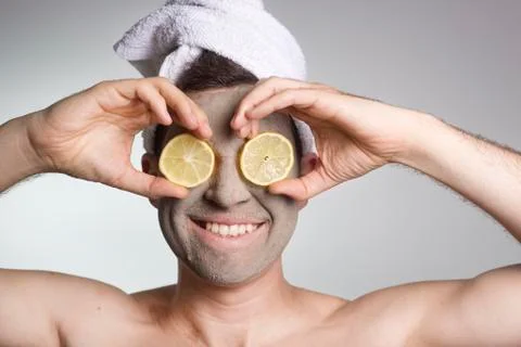 Man with a mud mask on this face Stock Photos
