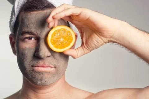 Man with a mud mask on this face Stock Photos