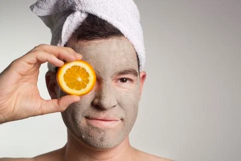 Man with a mud mask on this face Stock Photos