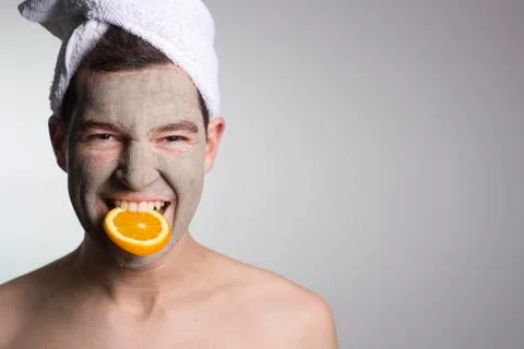 Man with a mud mask on this face Stock Photos