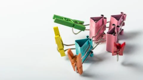 Man, from multi-colored office clips for paper on white background Stock Photos