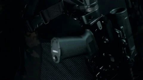 Man in a multicam on a black background with an AK on a tactical belt Video stock 144071083