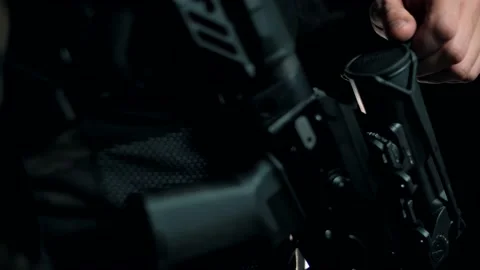 Man in a multicam on a black background with a modern Russian machine gun Stock Footage 144070713