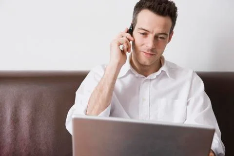A man multitasking Stock Photos