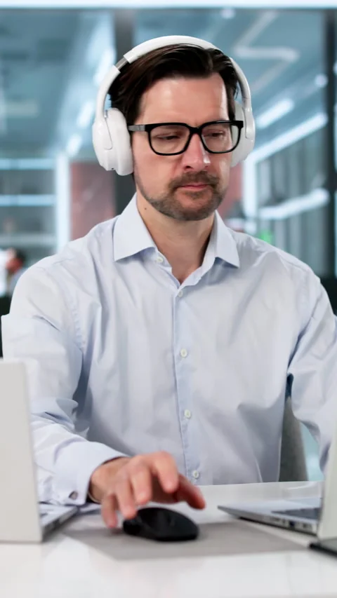 Man Multitasking On Two Laptops In Office Stock Footage 333849544