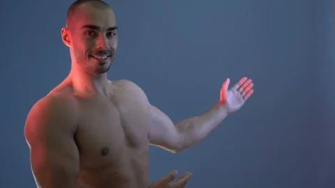 Man With Muscular Torso. Strong Athletic Man Fitness Model Torso Showing Stock Footage 118644537