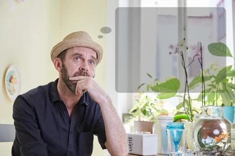 Man musing with a thought bubble over his head Stock Photos