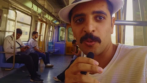 A man with a mustache and a hat on a train Stock Footage 292239673