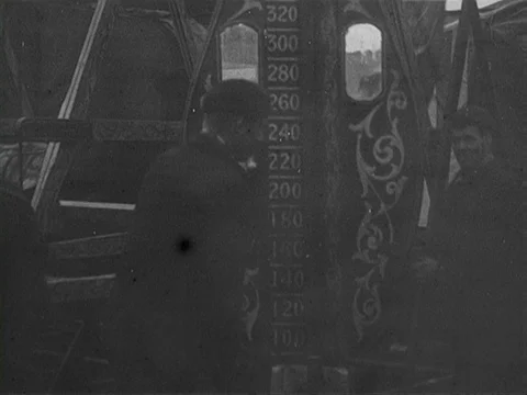Man with mustache and pipe playing with high striker at Hull fair, UK 1902 Stock Footage 136676435