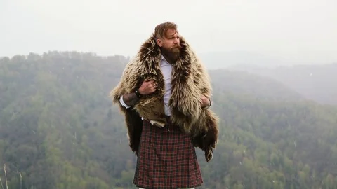 Man with mustache beard bear with a tattoo is standing mountain caucasian Stock Footage 110101626