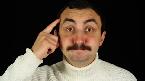 Man with mustache makes a gesture with his hand to think with his head Stock Footage 144484930
