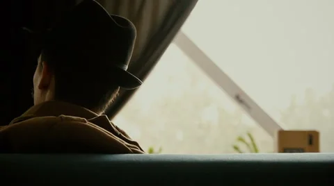 Man with a mustache sitting on a sofa Stock Footage 61667574