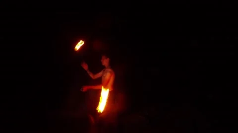 Man With a Naked Torso in the Darkness Making Fire Show Stock Footage 66365250