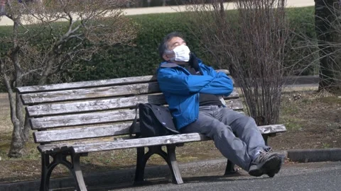 Man Napping In Imperial Palace Gardens In Tokyo, Japan Stock Footage 159003609