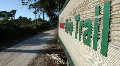 Man on Nature Trail Walks Past Sign HD Footage