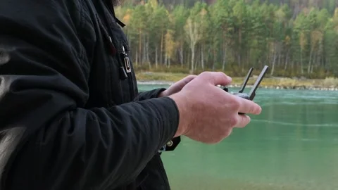 Man navigation flying quadcopter with remote control. Stock Footage 291362811