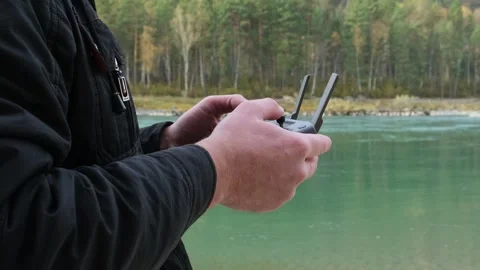 Man navigation flying quadcopter with remote control. Stock Footage 301591816