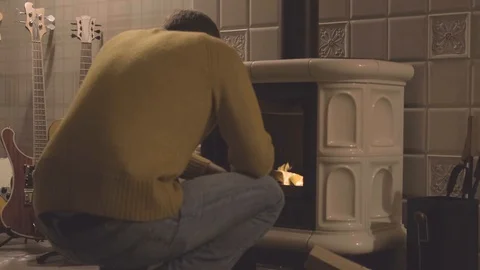 Man near the fireplace Stock Footage 122281602