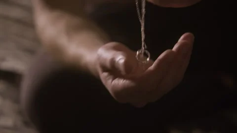Man with Necklace in Hand 動画素材 325104732