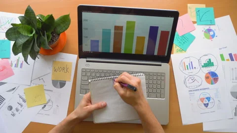 Man need help concept, office laptop surrounded by a lot of paperwork, top view Stock Footage 87384701