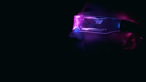 The man in neon glasses in the darkness Stock Footage 191507591