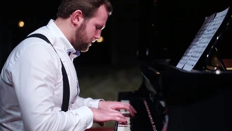 Man nervously playing the piano Stock Footage 75601266